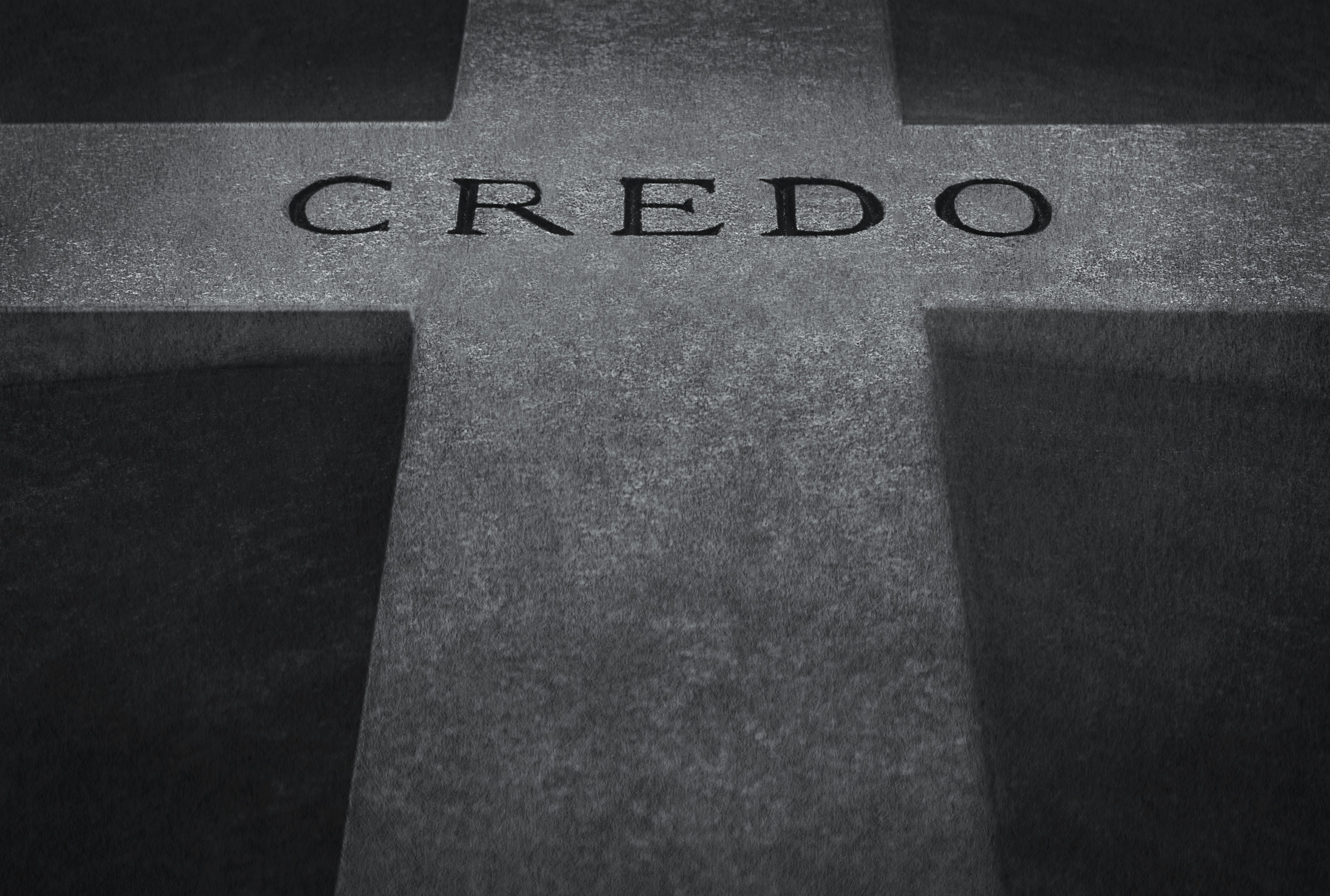Burial tomb in a Parisian cemetery, with the word creedo engraved in stone.